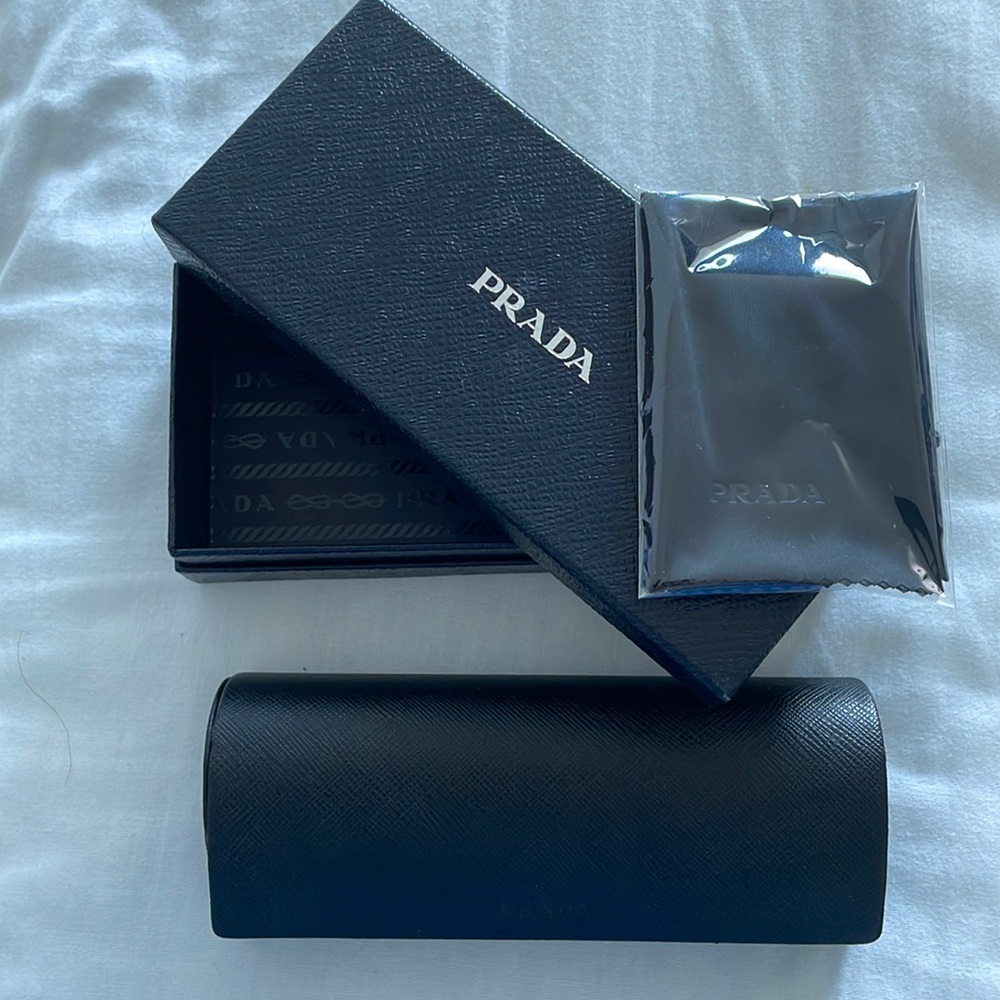 LAST DAY DEC. 10 
. MOVING. CLOSE OUT. NEW PRADA COMPLETE GLASSES BOX